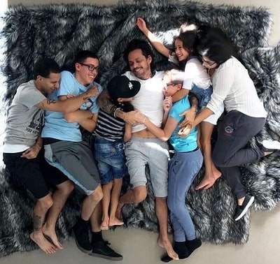 A picture of Maximilian David Muñiz with his father, twin sister, and all four-siblings.